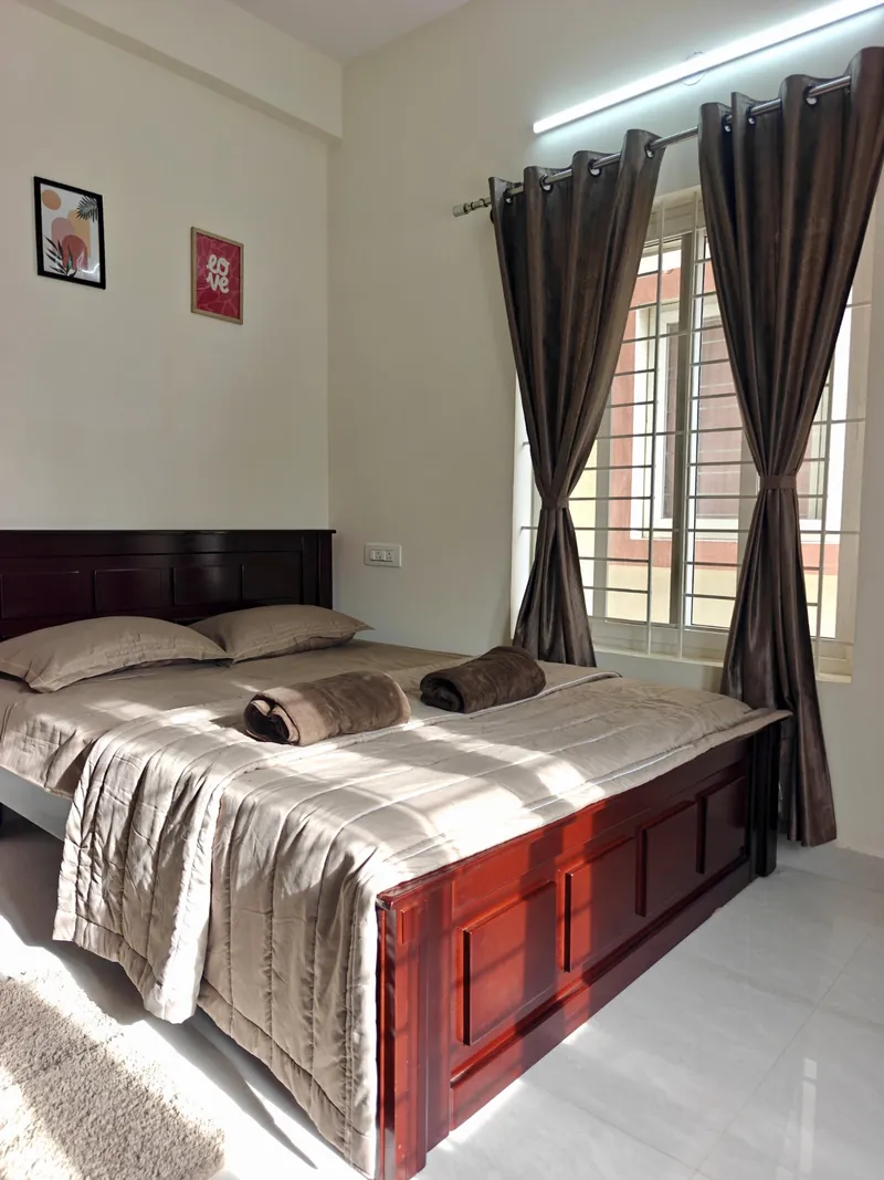 Bedroom one at The Cozy Taana homestay in Hoskote
